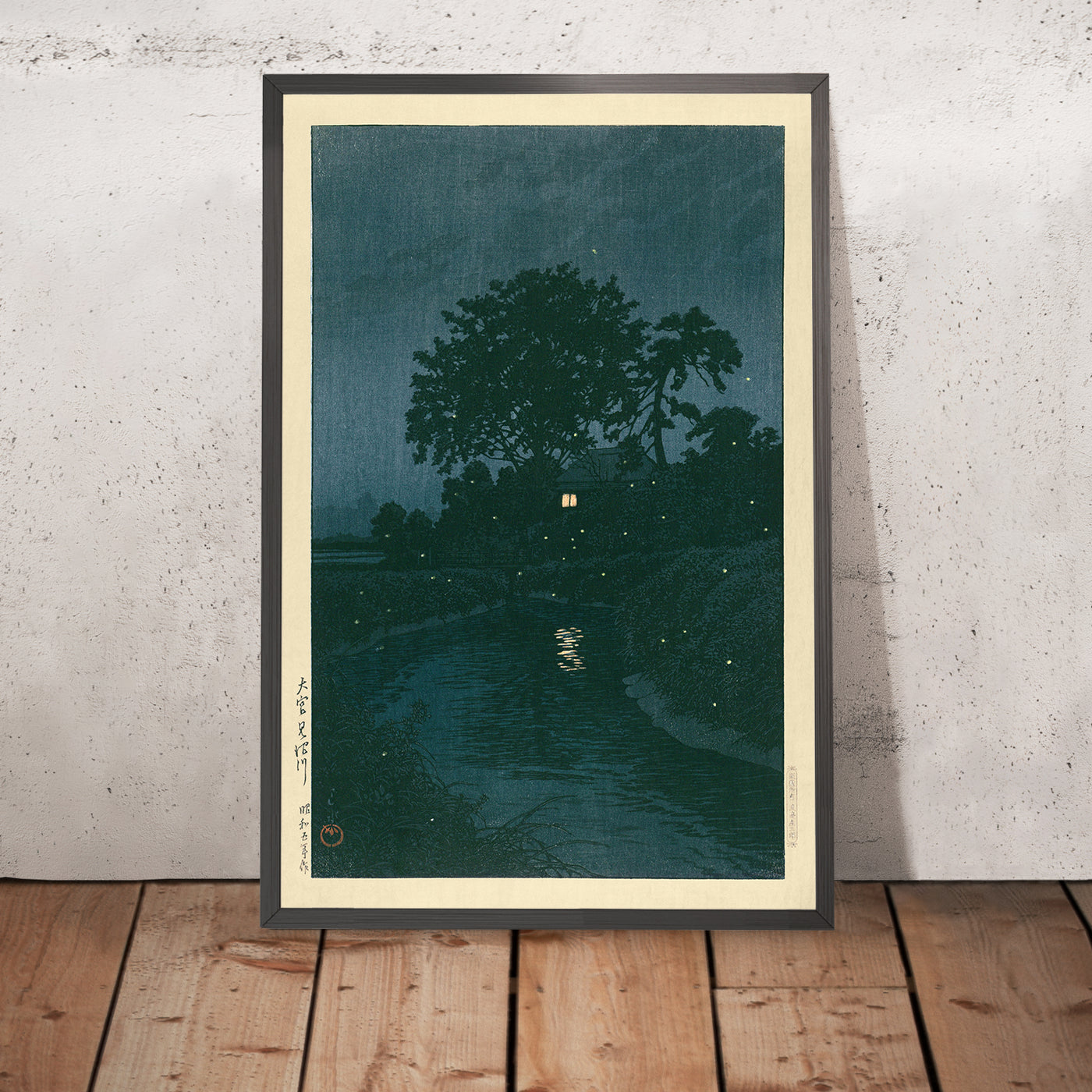 A framed image of Dark River with Fireflies by Hasui Kawase, 1935