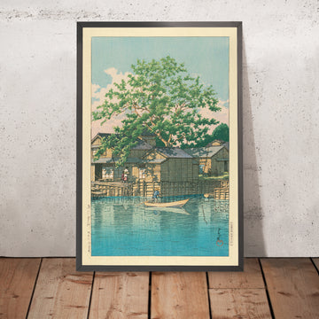 Una imagen enmarcada de River Village con Boatman and Tree de Hasui Kawase, 1935