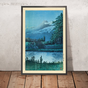 A framed image of Tagonoura Bridge and Mt. Fuji by Hasui Kawase, 1935