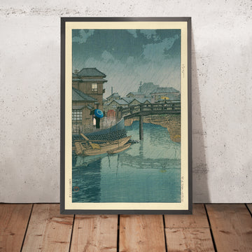 Ein gerahmtes Bild von Regenzeit in Ryoshimachi, Shinagawa von Hasui Kawase, 1935